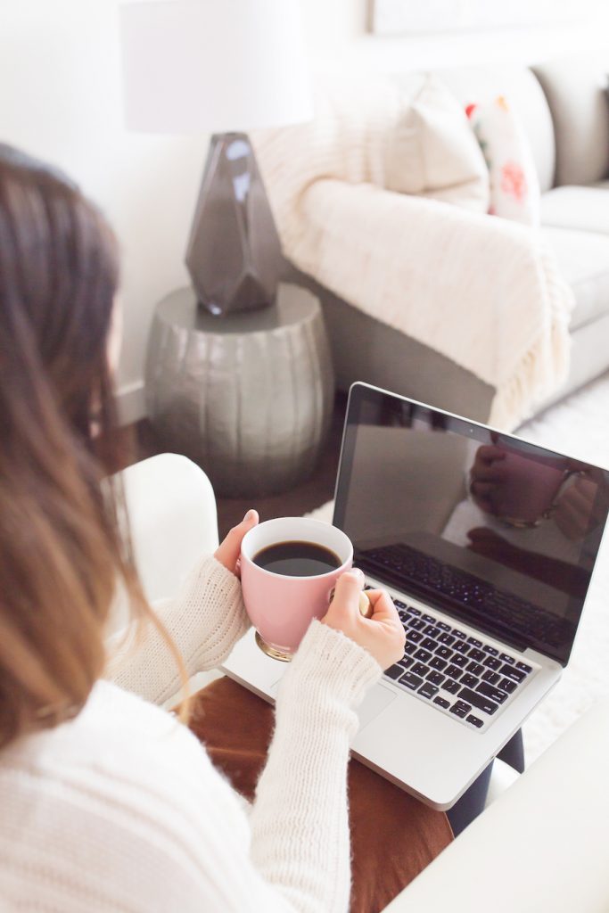 writing hacks woman with coffee and laptop